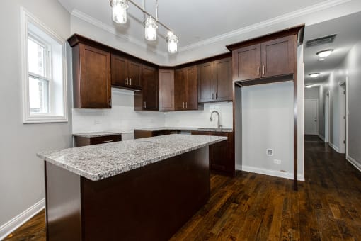 a kitchen with a granite counter top in a new home
