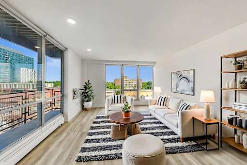 A modern living room with a view of the city.