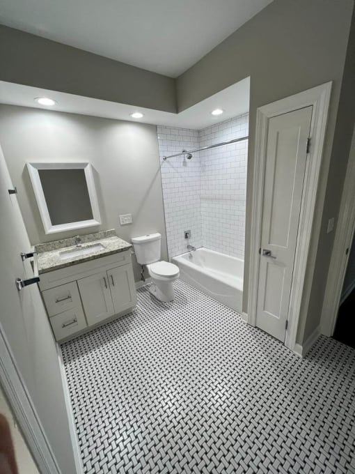 a bathroom with a toilet sink and bathtub