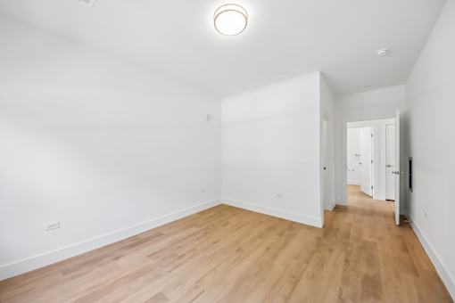 A room with wooden floors and white walls.