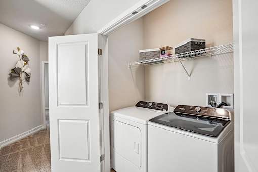 A laundry room with a washer and dryer.