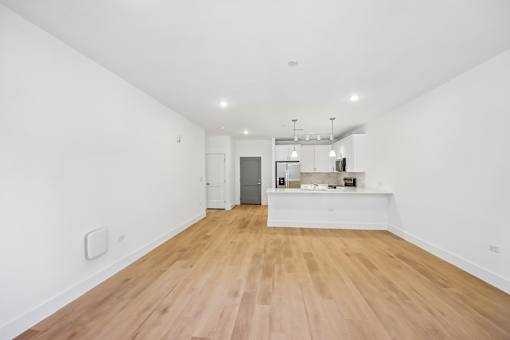 A room with wooden floors and white walls.