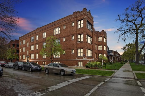 a red brick building on the corner of a city street