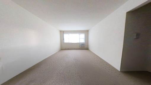 A room with a window and a door.