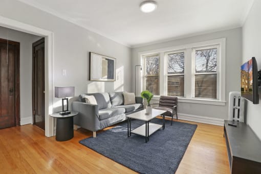 a living room with a couch and a table