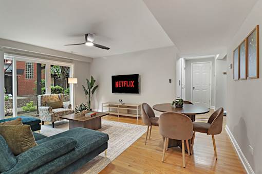 A living room with a TV displaying the Netflix logo.
