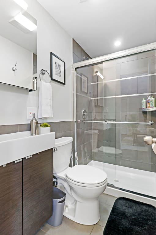 a bathroom with a toilet and a shower