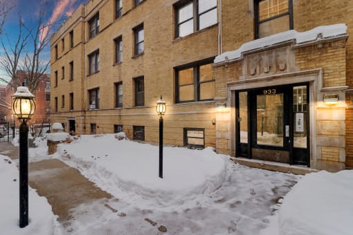 the building where the hotel is located is covered in snow