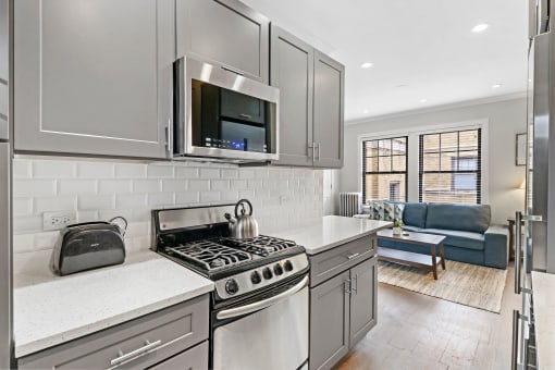 a kitchen with a stove and a microwave