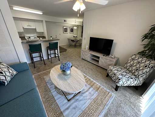 A living room with a grey couch and a coffee table.