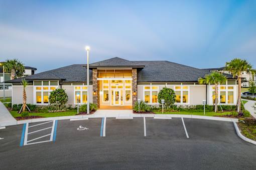 A building with a parking lot in front of it.