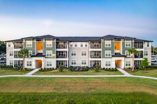 A large apartment complex with multiple buildings and balconies.