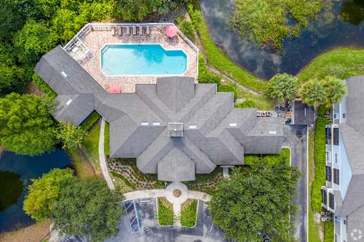 A large house with a pool in the backyard.