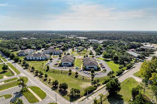 A bird's eye view of a residential area with houses and streets.