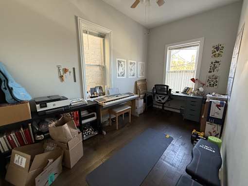 A room with a lot of boxes on the floor.