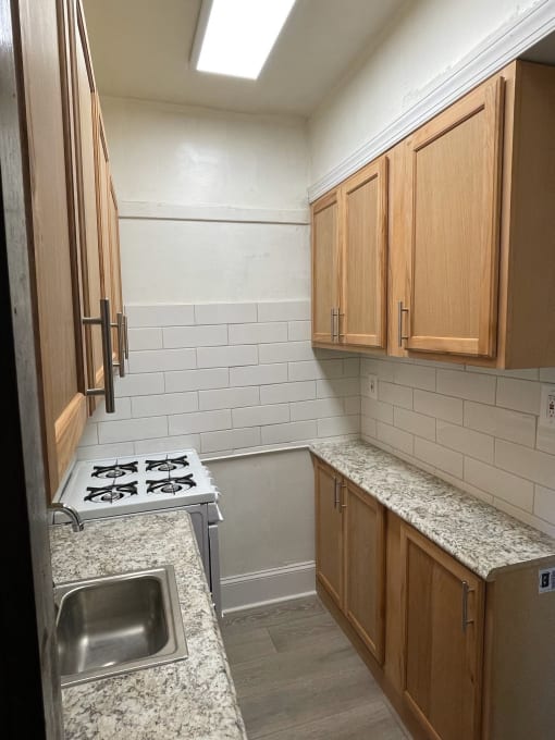a small kitchen with a stove and a sink