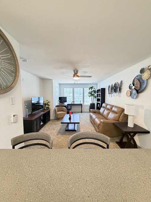 A living room with a couch and a chair.