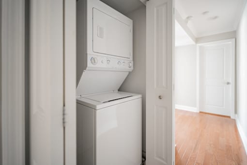 A white oven and dishwasher in a kitchen.