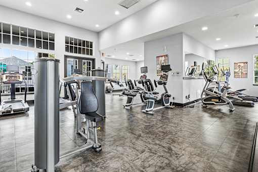 A gym with a variety of exercise equipment.