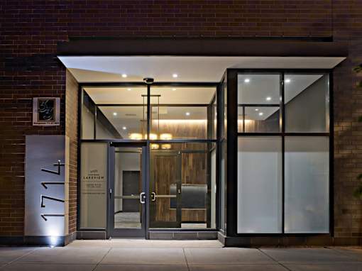 The entrance to a building with a glass door and a sign that reads "1777".
