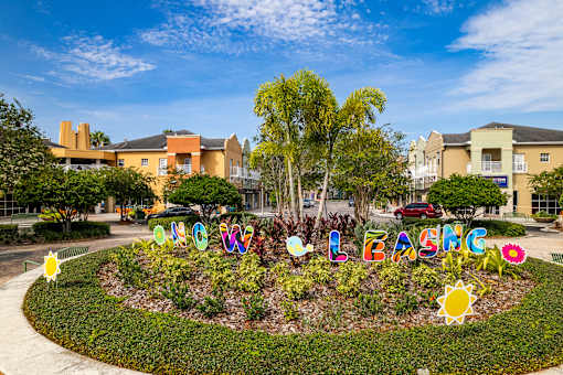 A colorful garden with the word "LASG" spelled out in decorative letters.
