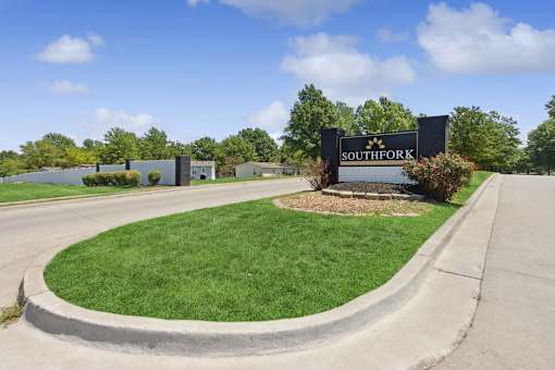 Property sign at entry at Southfork MHC in Belton, MO