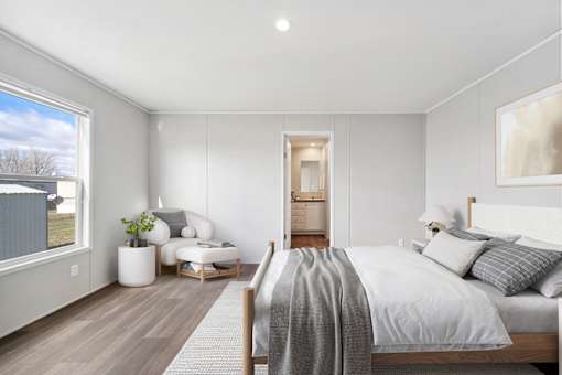 Model bedroom and closet at Cedar Ridge Manufactured Home Community  in Wichita, Kansas
