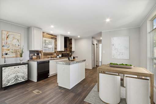 Model kitchen and dining area at Southfork MHC in Belton, MO