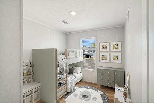 A small child's bedroom with a bunk bed and a dresser.