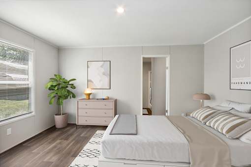 Model bedroom at Southfork MHC in Belton, MO