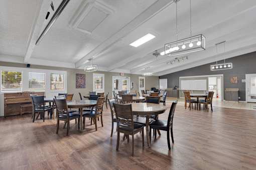 A dining room with a table set for six.