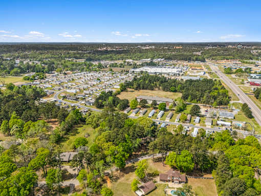 A bird's eye view of a residential area with houses and trees.