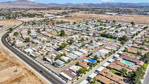 A large suburban neighborhood with houses and a road.