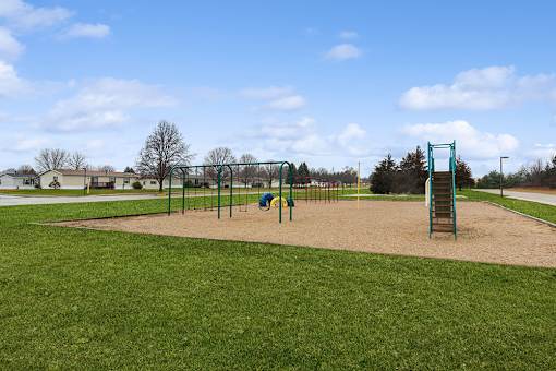 Playground at Cedarfield Manufactured Homes Community in Cedar Springs, MI