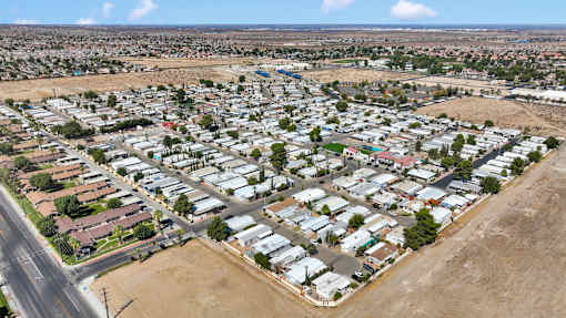 A large residential area with numerous houses and a road.