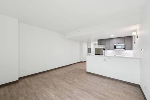 A kitchen area with a countertop and cabinets.