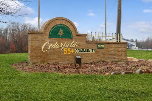 Property sign at Cedarfield Manufactured Homes Community in Cedar Springs, MI