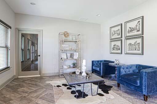 A Living Room With a Blue Velvet Sofa at Arbours at Pierce Creek, Mobile, AL, 36608