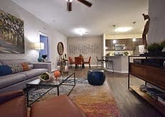 Living Area With Kitchen View at Arbours at Crown Point, Ocoee, 34761