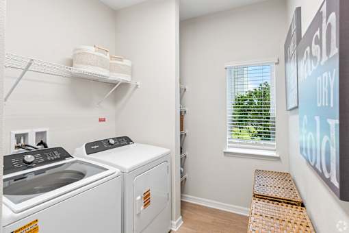 A laundry room with a washer and dryer.