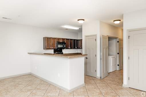 A Kitchen Area With White Counter at Arbours at Pierce Creek, Mobile, AL