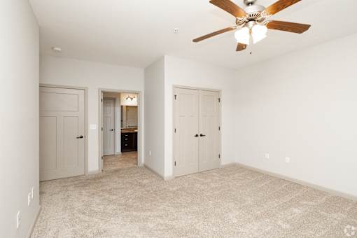 A Bathroom With a Carpeted Floor at Arbours at Pierce Creek, Mobile, AL