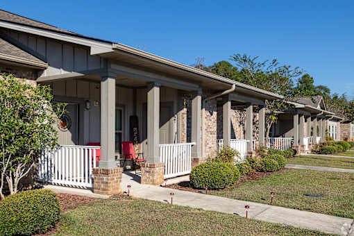 A Row of Houses With White Picket Fences at Arbours at Pierce Creek, Mobile