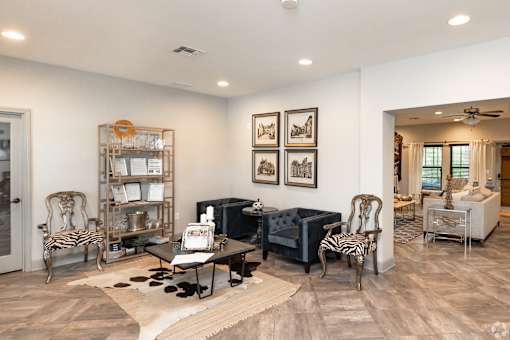 A Living Room With a Black Chairs at Arbours at Pierce Creek, Mobile, Alabama
