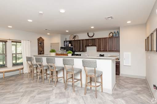 A Kitchen With a White Island at Arbours at Pierce Creek, Alabama