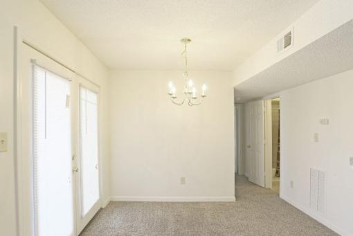 A Living Room With Chandelier at Magnolia Court Apartments, Birmingham, AL, 35215