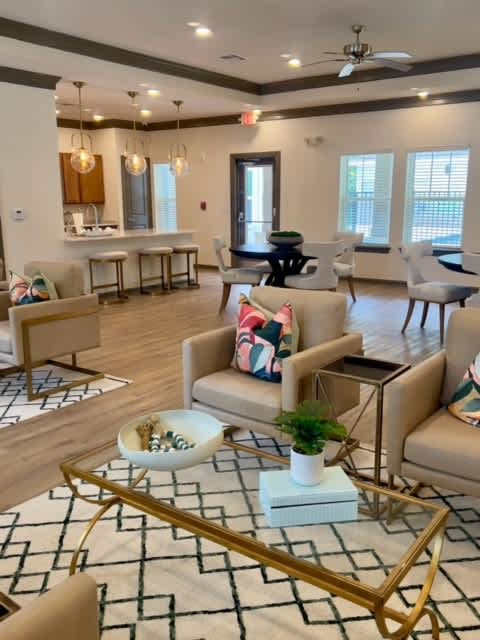 A Living Room With a White Sofa at Arbours at Quincy, Quincy, 32351