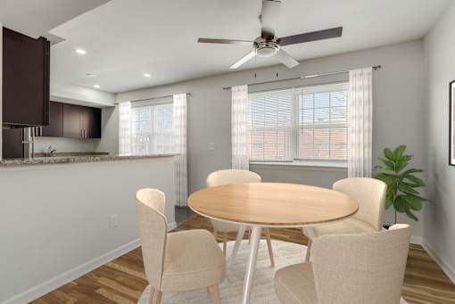 A dining room with a round table and chairs. at Chatham Hill, New Jersey, 07928
