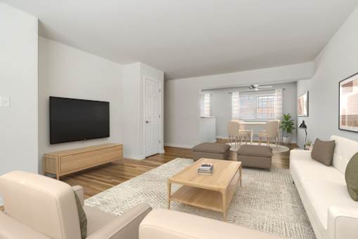 A living room with a white couch, a wooden coffee table, and a flat-screen TV. at Chatham Hill, New Jersey, 07928