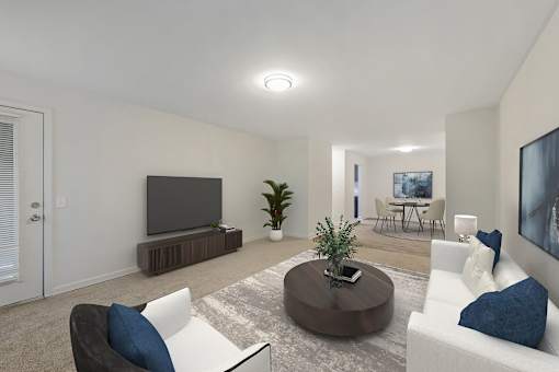 a living room with a couch and a tv at Riverchase Landing, Hoover